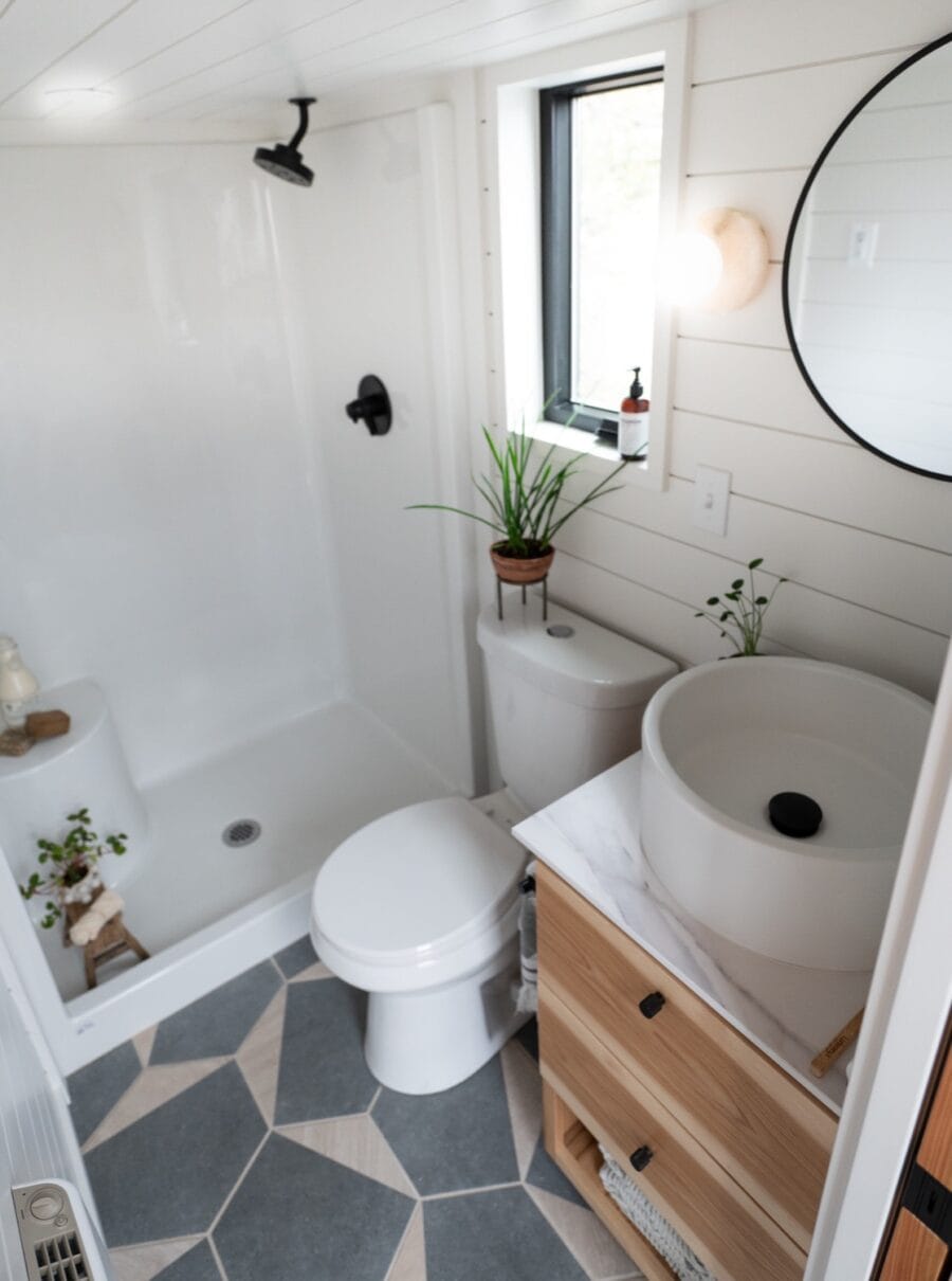 Bathroom in a tiny house with minimalist decor and natural light.