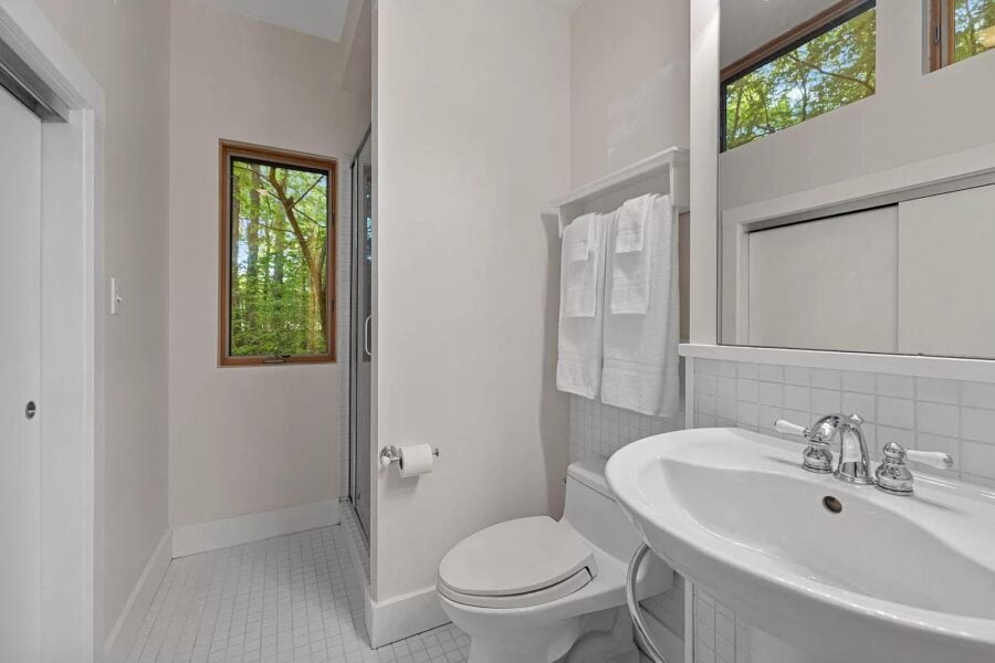 Bathroom in a modern tiny cabin with natural light and minimalist design.