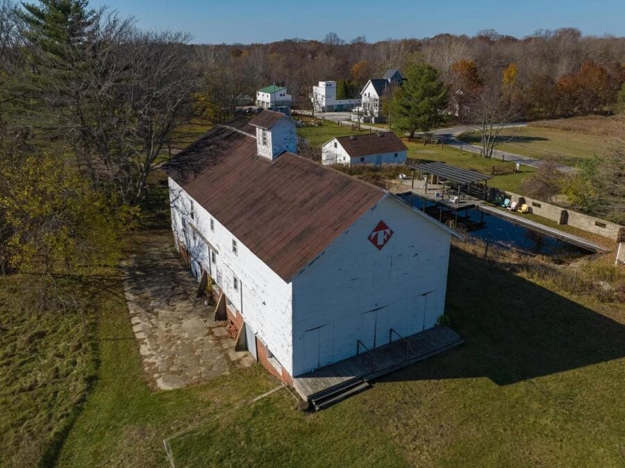 Historic barn converted into a cozy tiny house in a scenic rural setting. Perfect for small space li.