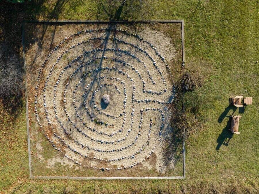 A circular rock garden with a central stone, symbolizing freedom in small spaces.