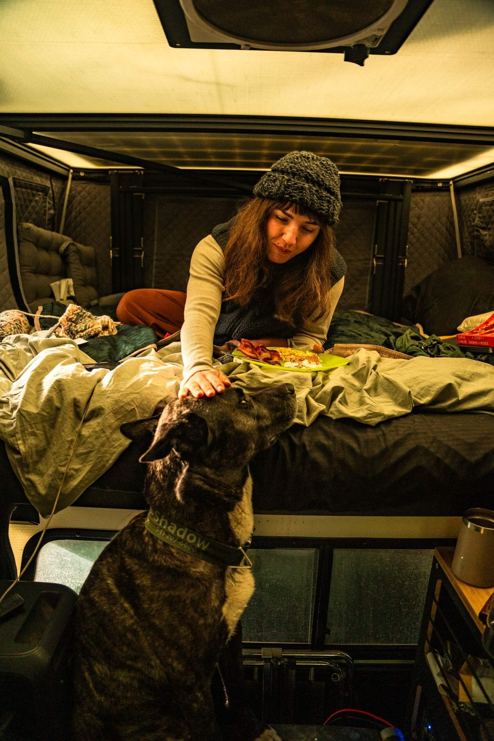 Tune M1 truck camper parked in forest setting