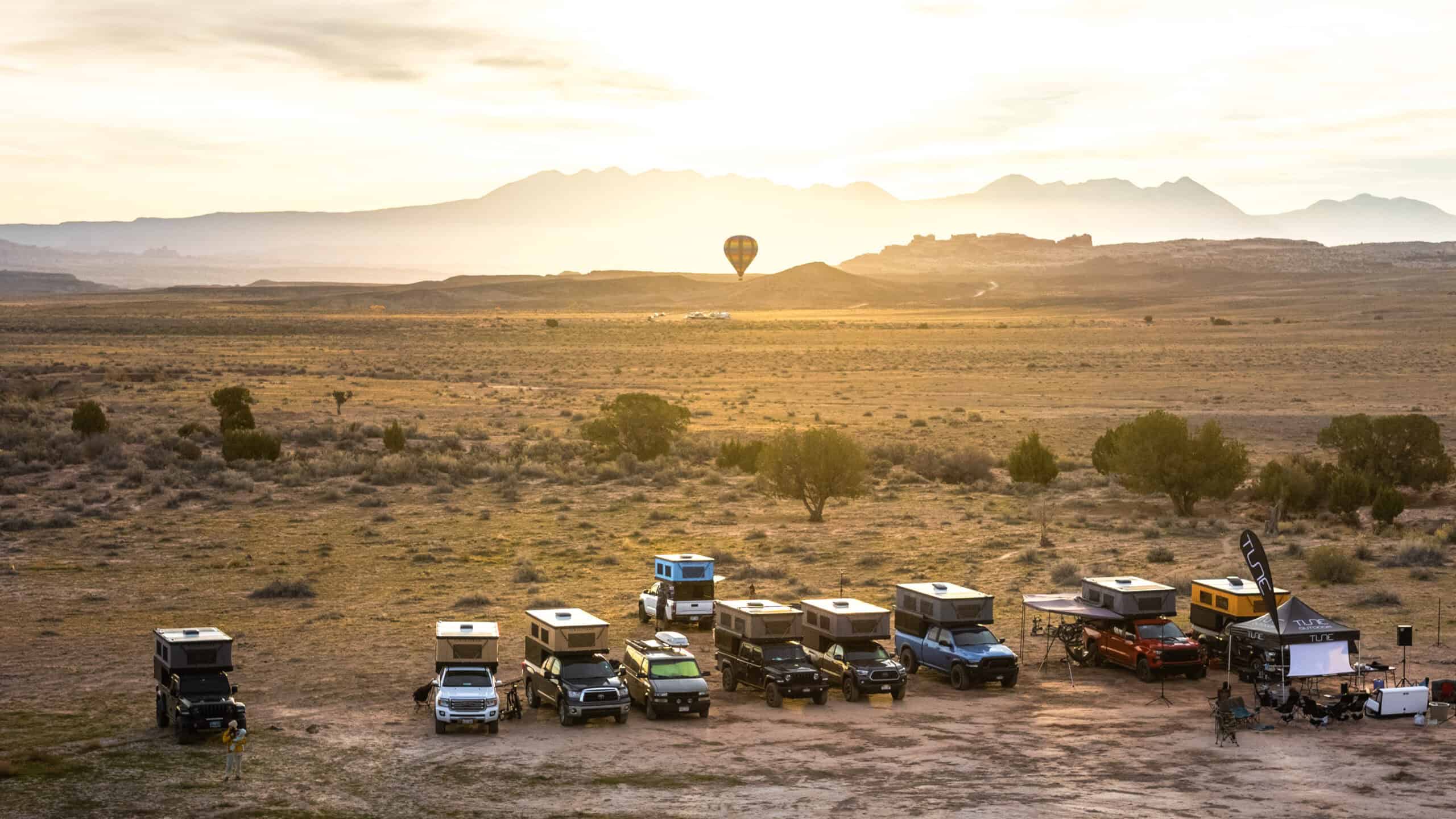 Tune M1 camper at sunrise showcasing the panoramic windows
