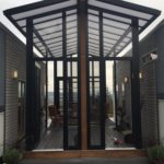 Two 24′ Tiny Houses Connected by Sunroom 002