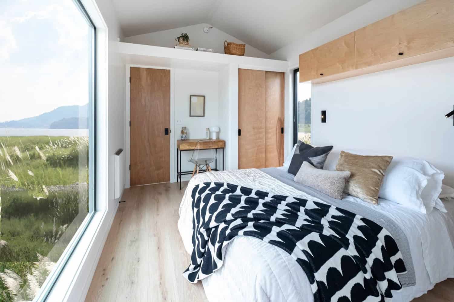 Urban Gable Park master bedroom with corner picture window, sliding closets and a lake view