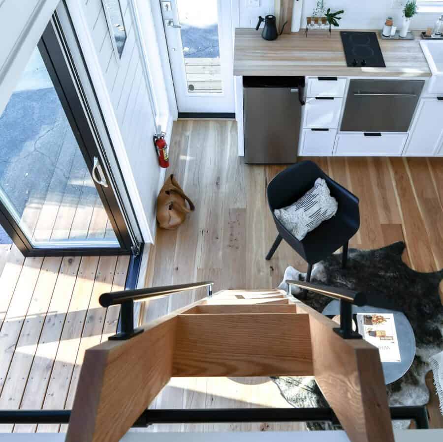 Modern tiny house interior with compact kitchen and cozy living space.