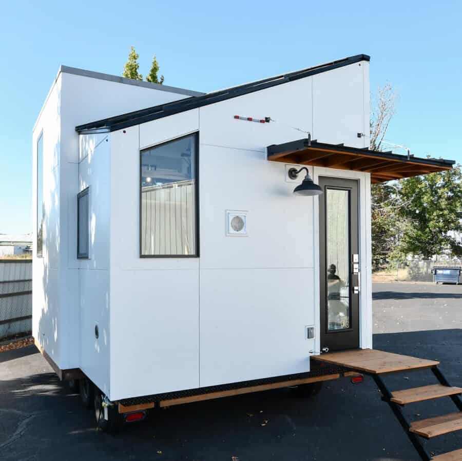 Modern 18 ft. tiny house with sleek design and small footprint.