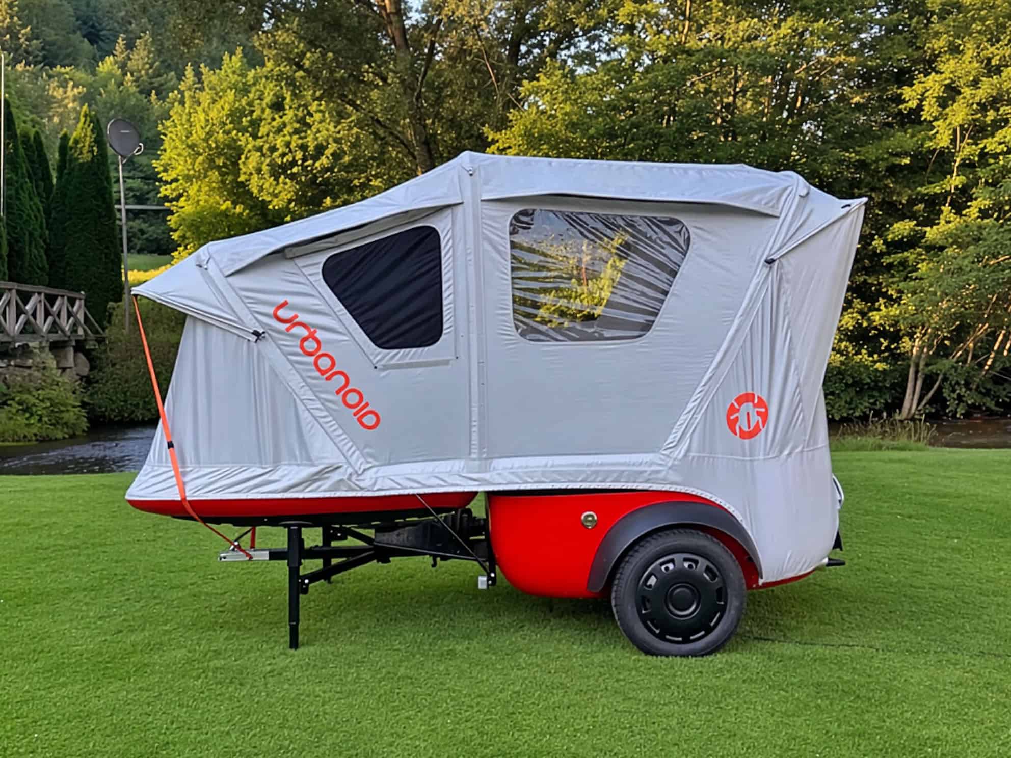 Side profile of the Urbanoid Booba with its inflatable tent fully deployed on a lawn