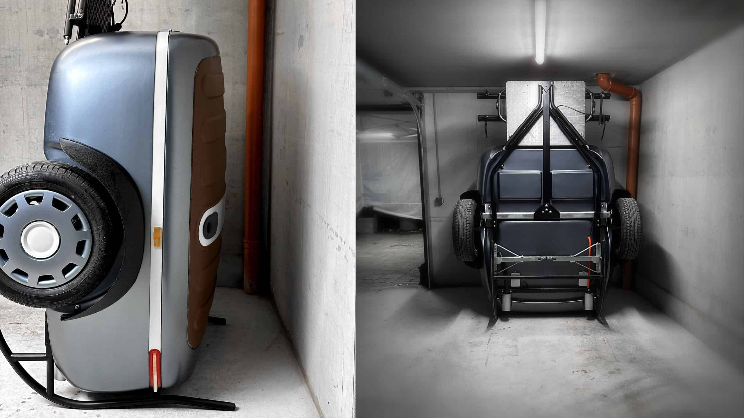 Urbanoid Booba trailer stored upright against a garage wall on its roll-on stand