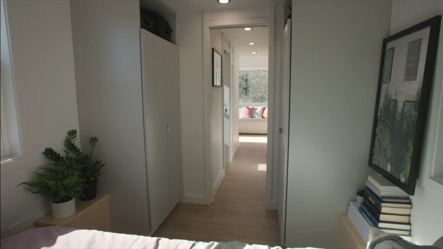 Interior view of a 28-ft VIA tiny home with a first-floor bedroom and modern decor.