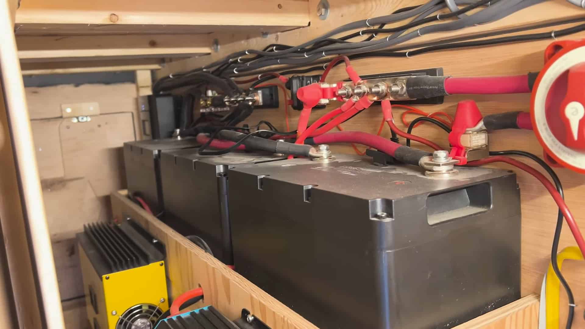 Battery bank wired with bus bars and heavy cabling for off-grid power