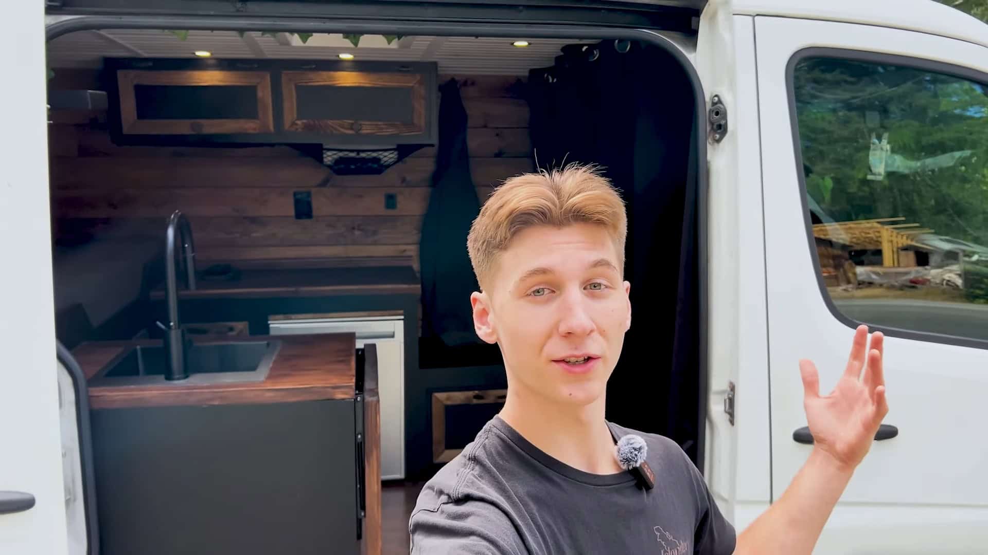 VanLifeNate beside his finished DIY Mercedes-Benz Sprinter camper conversion