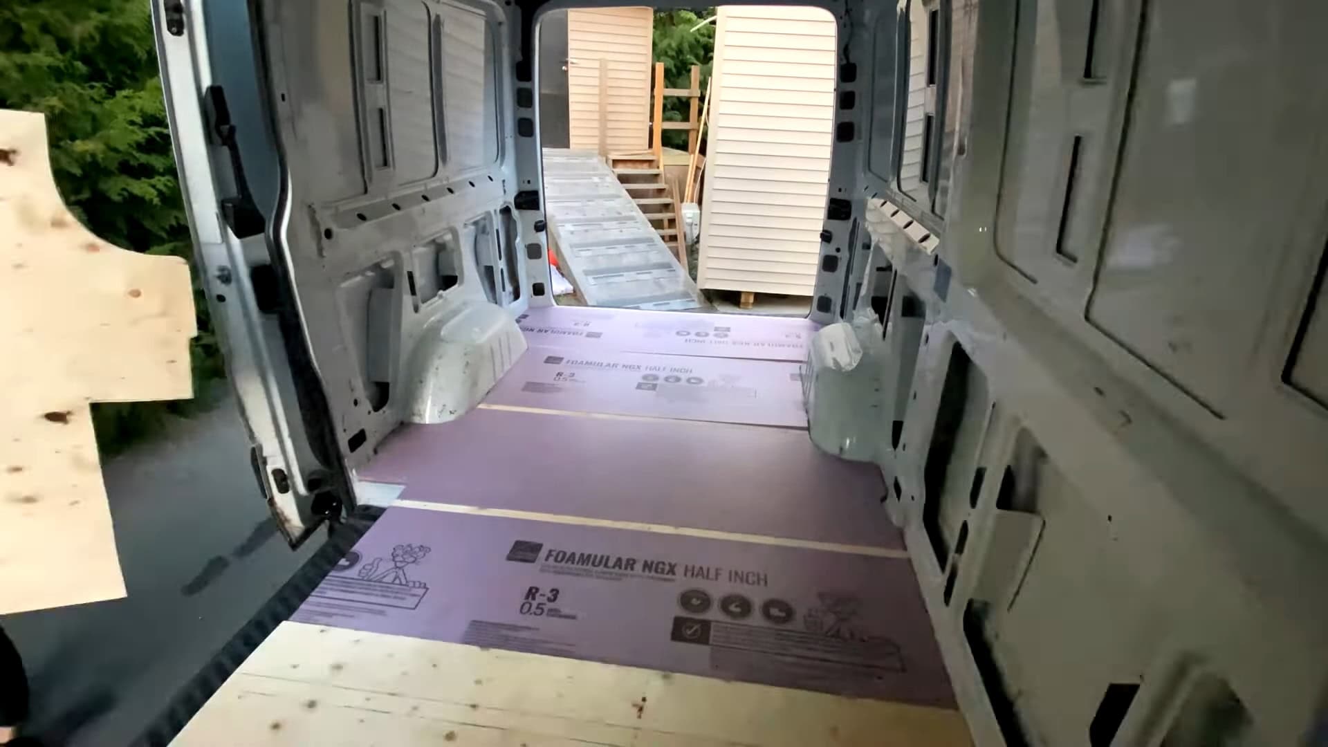 FOAMULAR NGX rigid foam board floor insulation laid down inside the Sprinter van