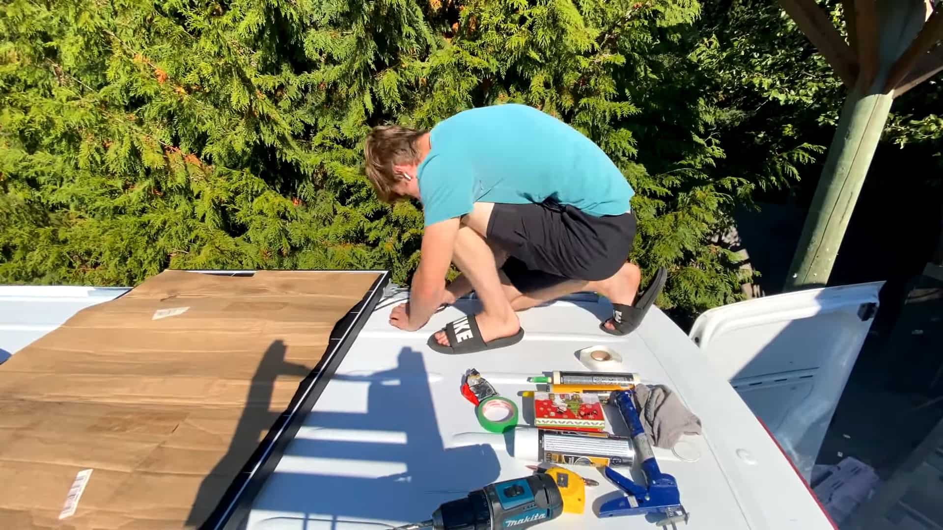 Mounting a flexible solar panel on the roof of the Sprinter van