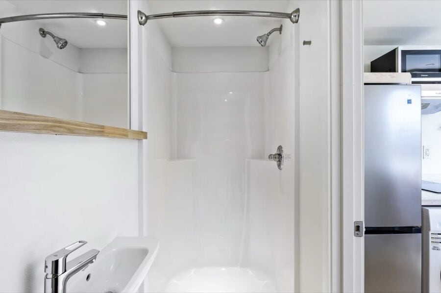 Bathroom shower in a tiny house rental.