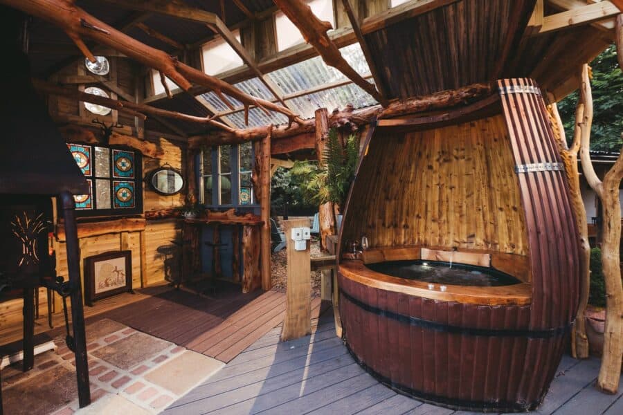 Wine barrel hot tub inside the Wild Cherry Barn at the Wagon in the Woods
