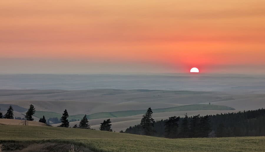 Scenic sunset over rolling hills, ideal for tiny house parking spots.