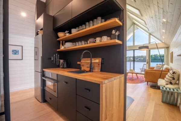 Scandinavian Waterfront Cabin: Modern Black Metal Exterior with ... - Waterfront Scandinavian Suburban Design