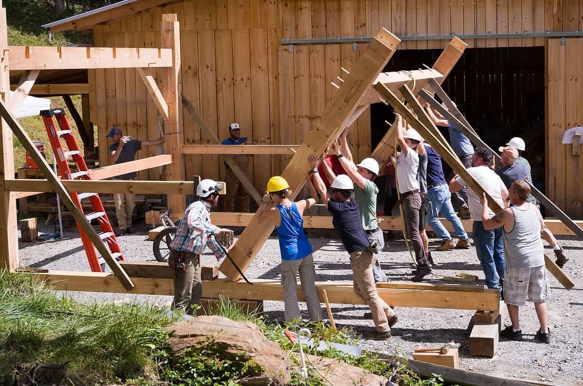 Students raising a timber frame during the Wild Abundance workshop in Barnardsville NC