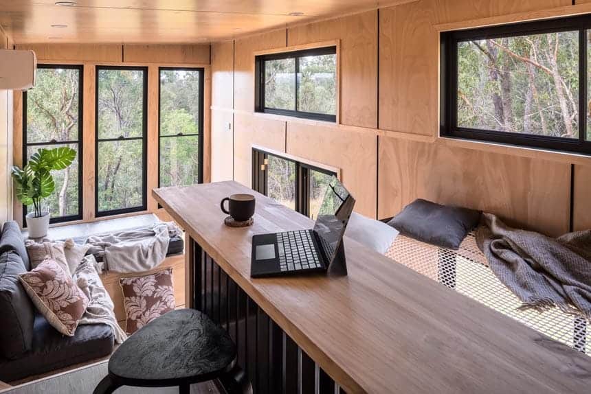 Elevated study and office nook above the dining area in the Wildscape tiny house