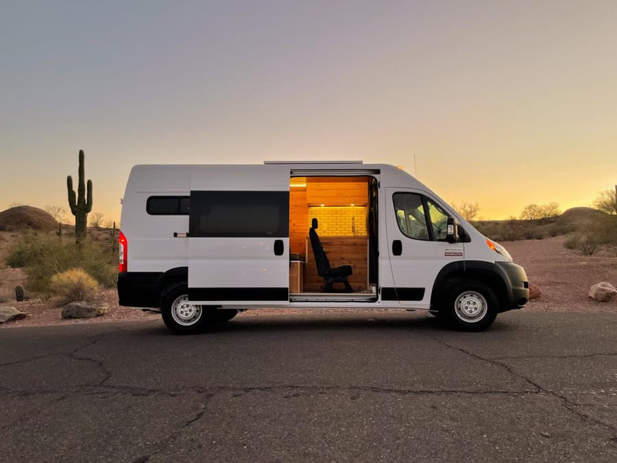 Modern camper van with cozy interior, perfect for tiny house enthusiasts and adventure seekers.