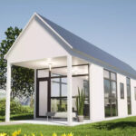 Charming white tiny house with large windows and a covered porch, perfect for compact living in scen.