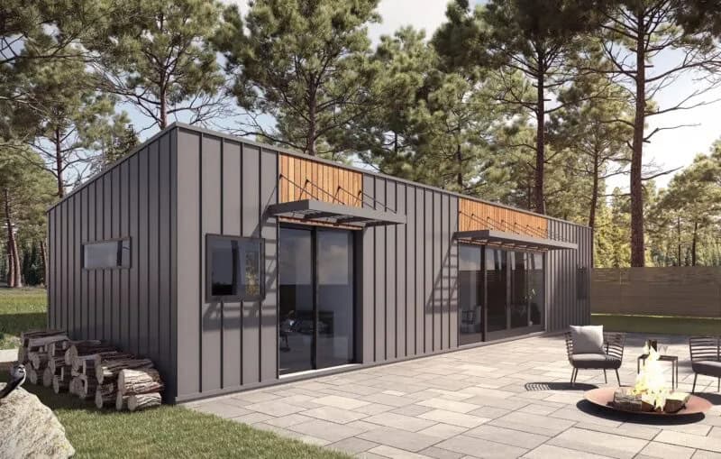 Modern prefab pod home with sleek design and outdoor patio.