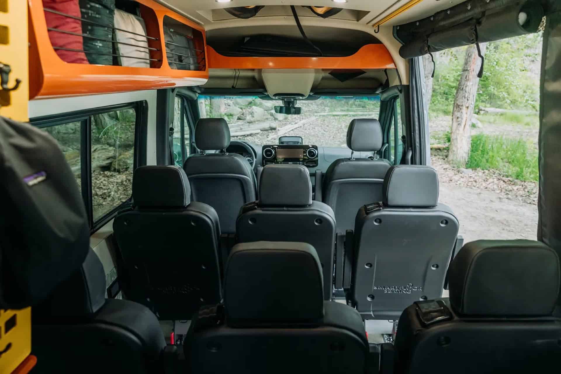 Interior of GB01 configured with multiple rows of seats facing forward toward the cab