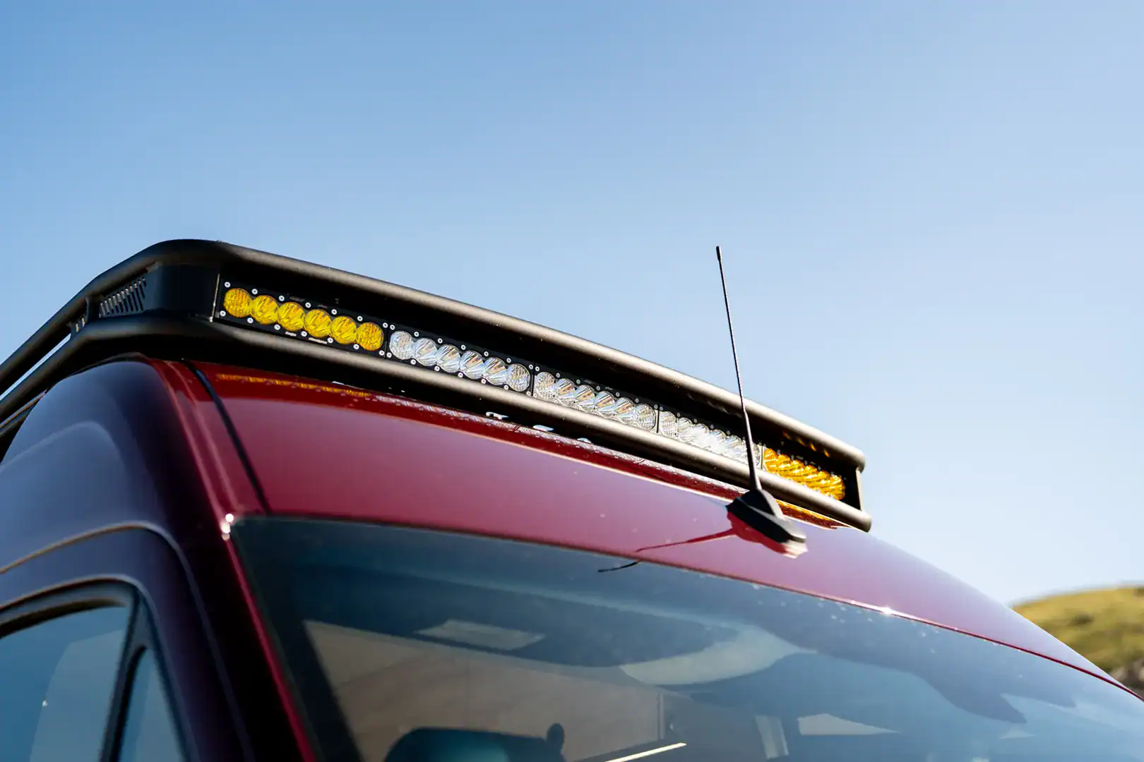 A roof-mounted LED light bar on the front rack of the Yama Vans Brio Sprinter