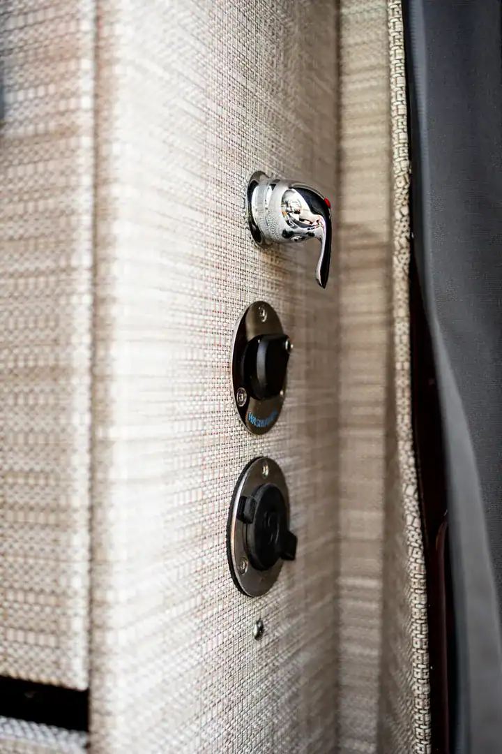 A textile-lined wardrobe with hooks inside the Yama Vans Brio