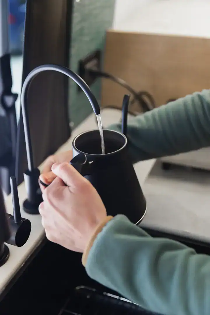 An on-demand filtered drinking-water tap in the Yama Vans Furō galley