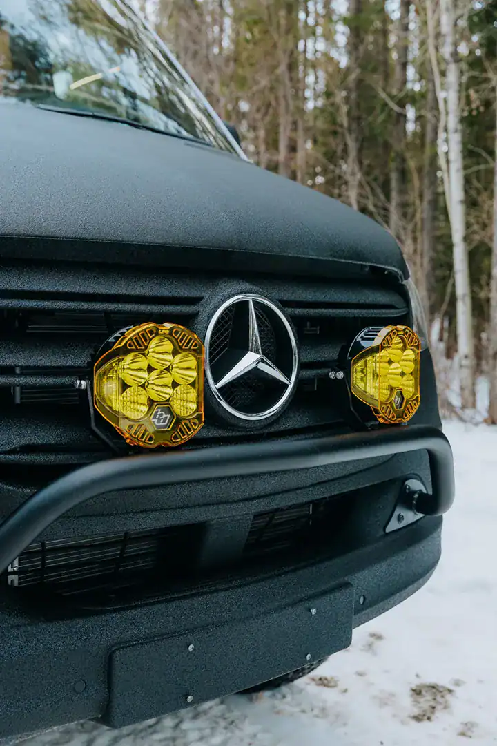 Auxiliary off-road lights flanking the Mercedes star on the front of the Yama Vans Furō