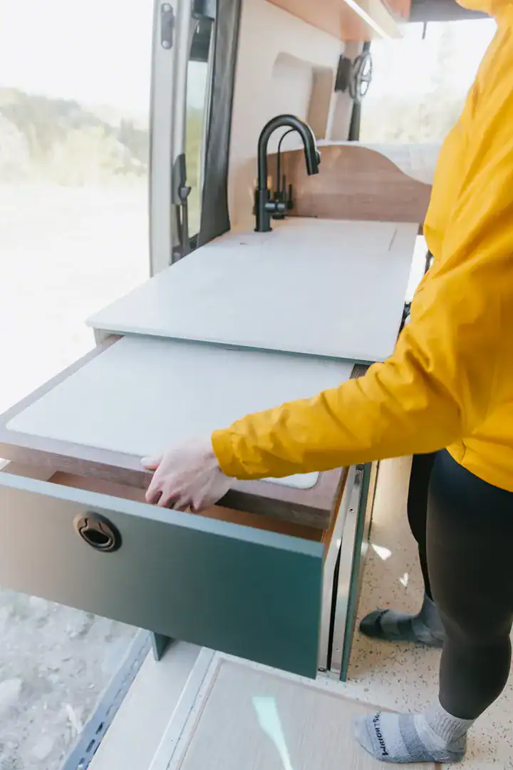 A pull-out counter extension expanding the prep space in the Yama Vans Taiyō galley