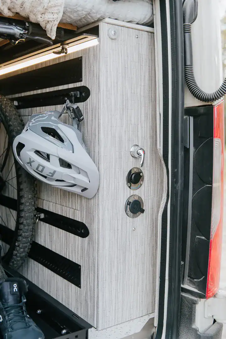 Helmet and gear storage on a MOLLE panel inside the Yama Vans Taiyō