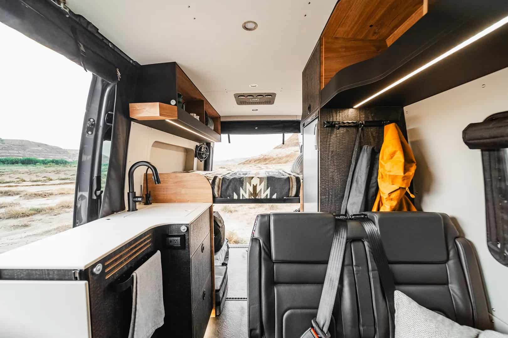 Rear seating and slide-out table inside the Yama Vans Teton 01N