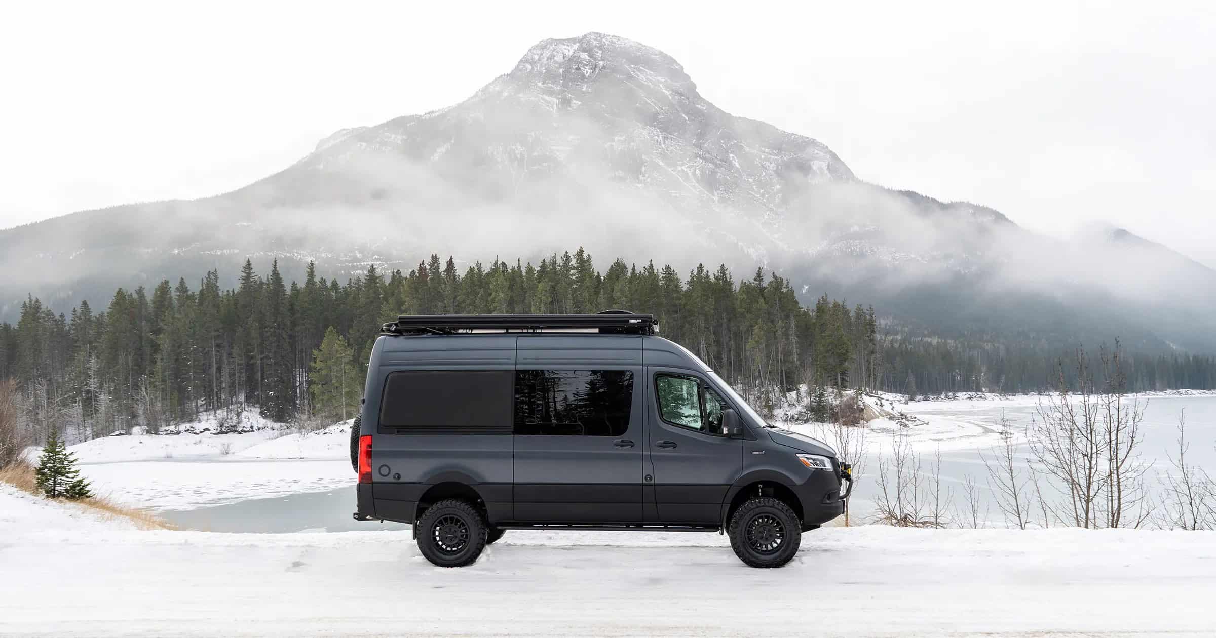 Yama Vans Teton 01N Kori adventure van parked in front of snowy mountains