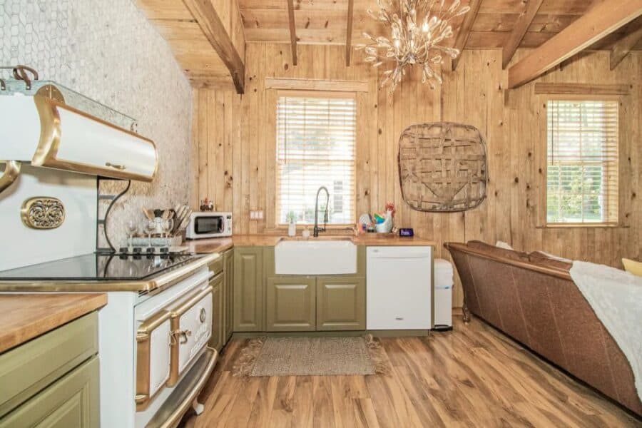 Charming tiny house kitchen with rustic wood accents and modern appliances in Zephyrhills, Florida.