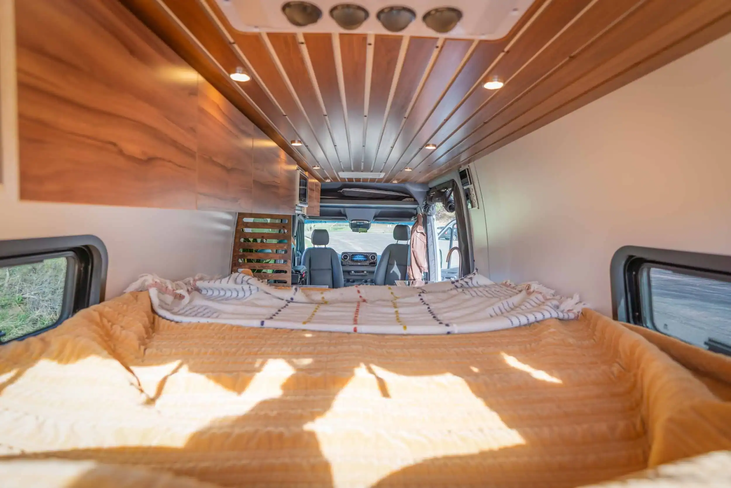 Zeppelin Sprinter rear bedroom with comfortable sleeping platform and ambient lighting