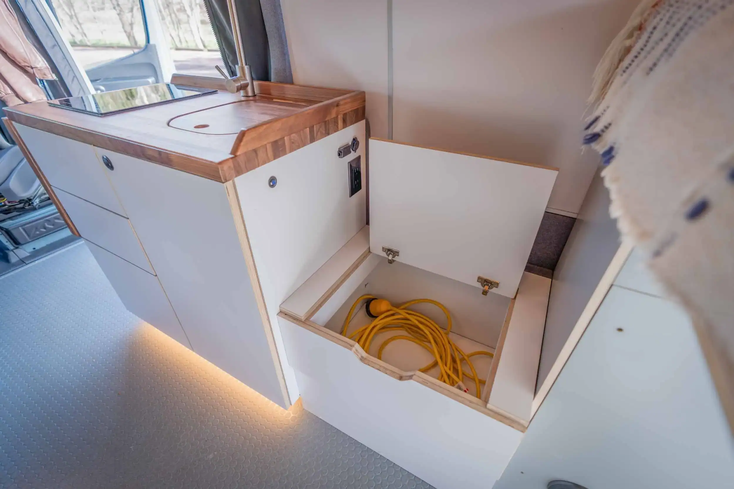 Zeppelin Sprinter galley kitchen with countertop and storage compartments