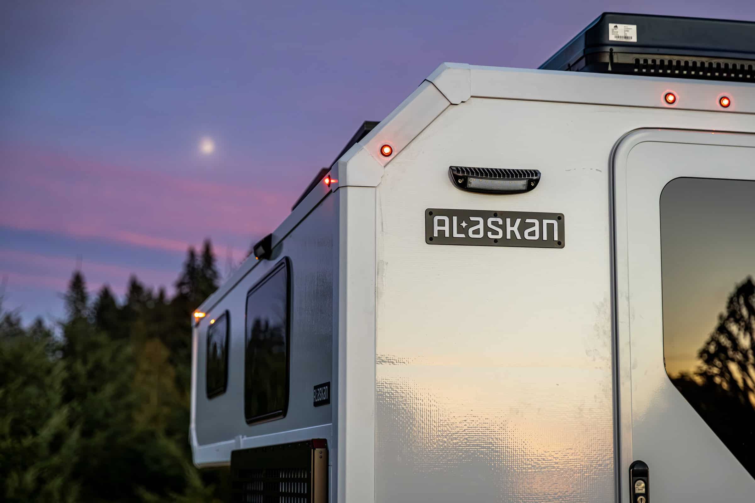 Close rear corner, badge, and marker lights at dusk