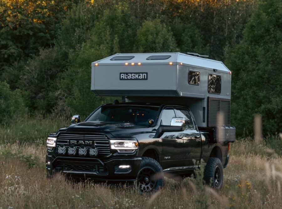 Gray hard-sided pop-up on a black Ram in a dusk meadow