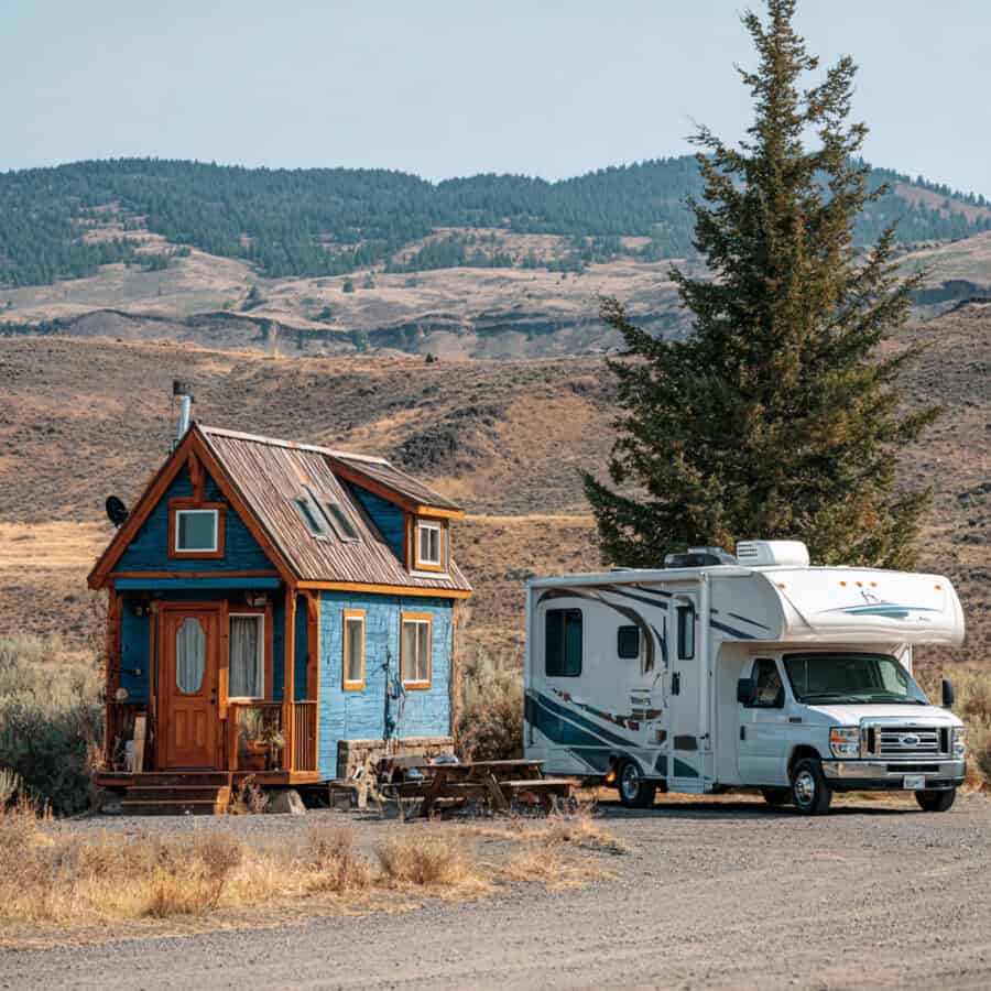 alexpino_an_RV_parked_next_to_a_tiny_house_at_a_campground_–_8474bf60-75fd-43c0-8e3f-9781e494829a_0