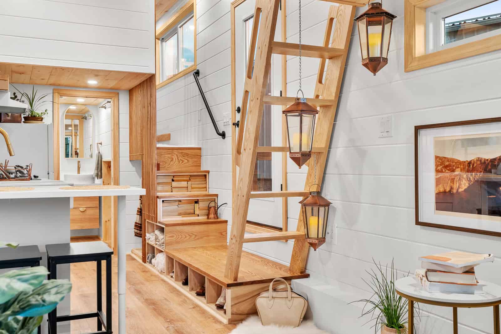 Honey Bee storage stairs, copper lanterns, bath doorway with vessel sink beyond