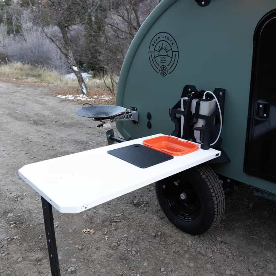 Sage Bean Stock 2.0 teardrop with outdoor side table, collapsible sink, and swivel griddle deployed