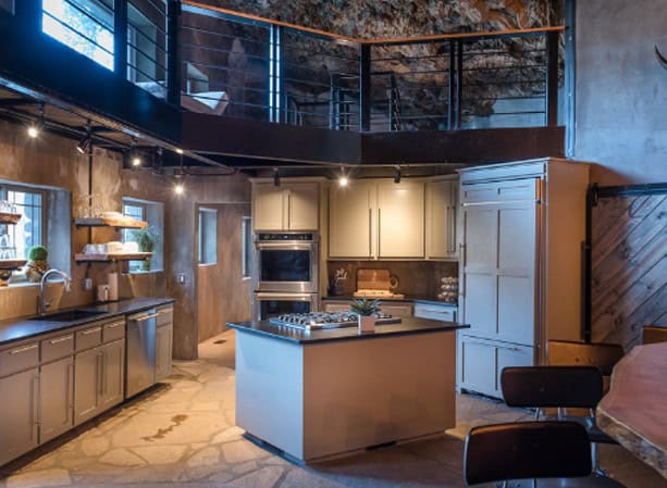 Kitchen with an island and a loft rail