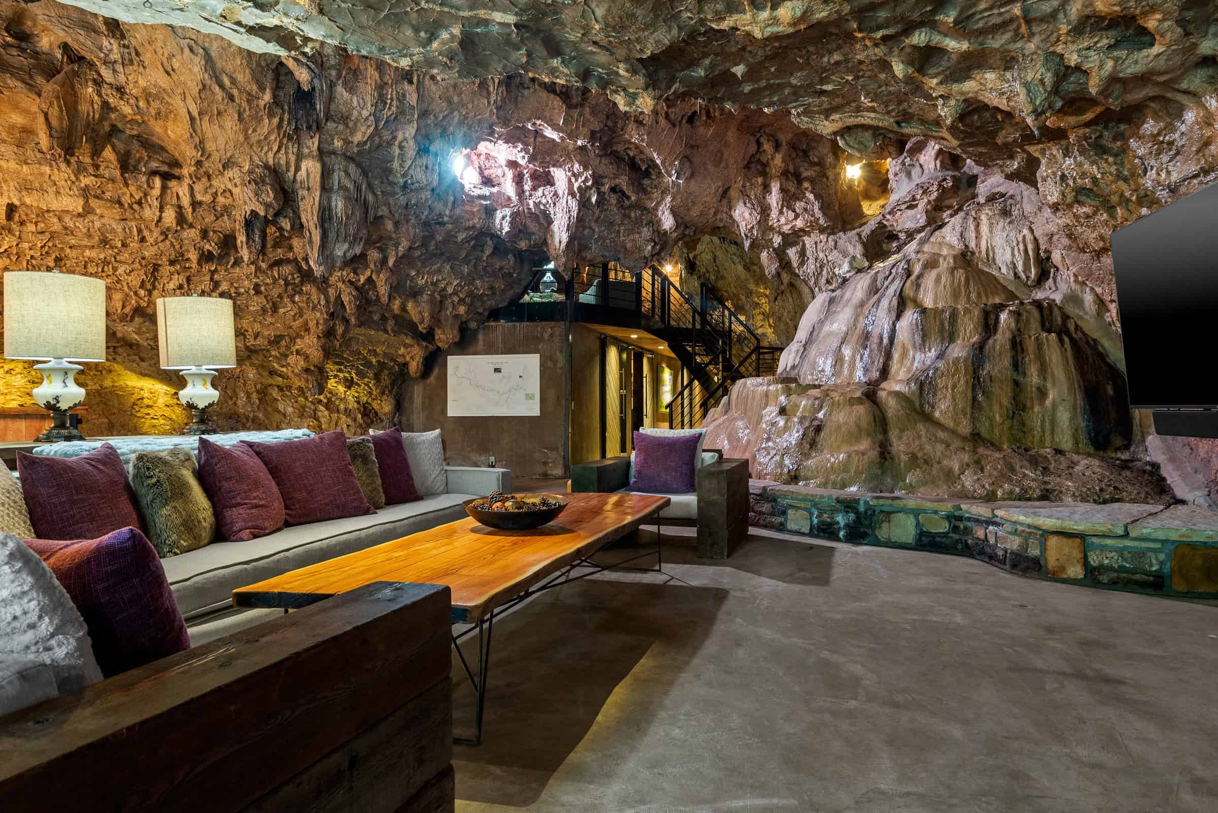 Living room with sofas and a rock wall