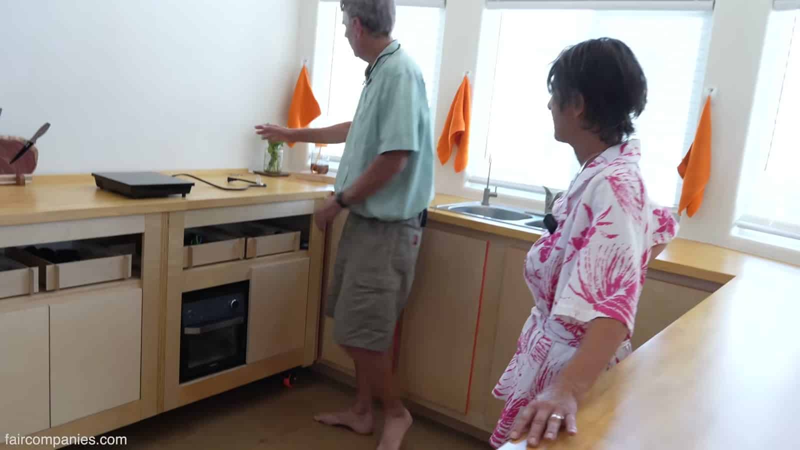 Kitchen with rolling maple counters, built-in sink, and compact oven