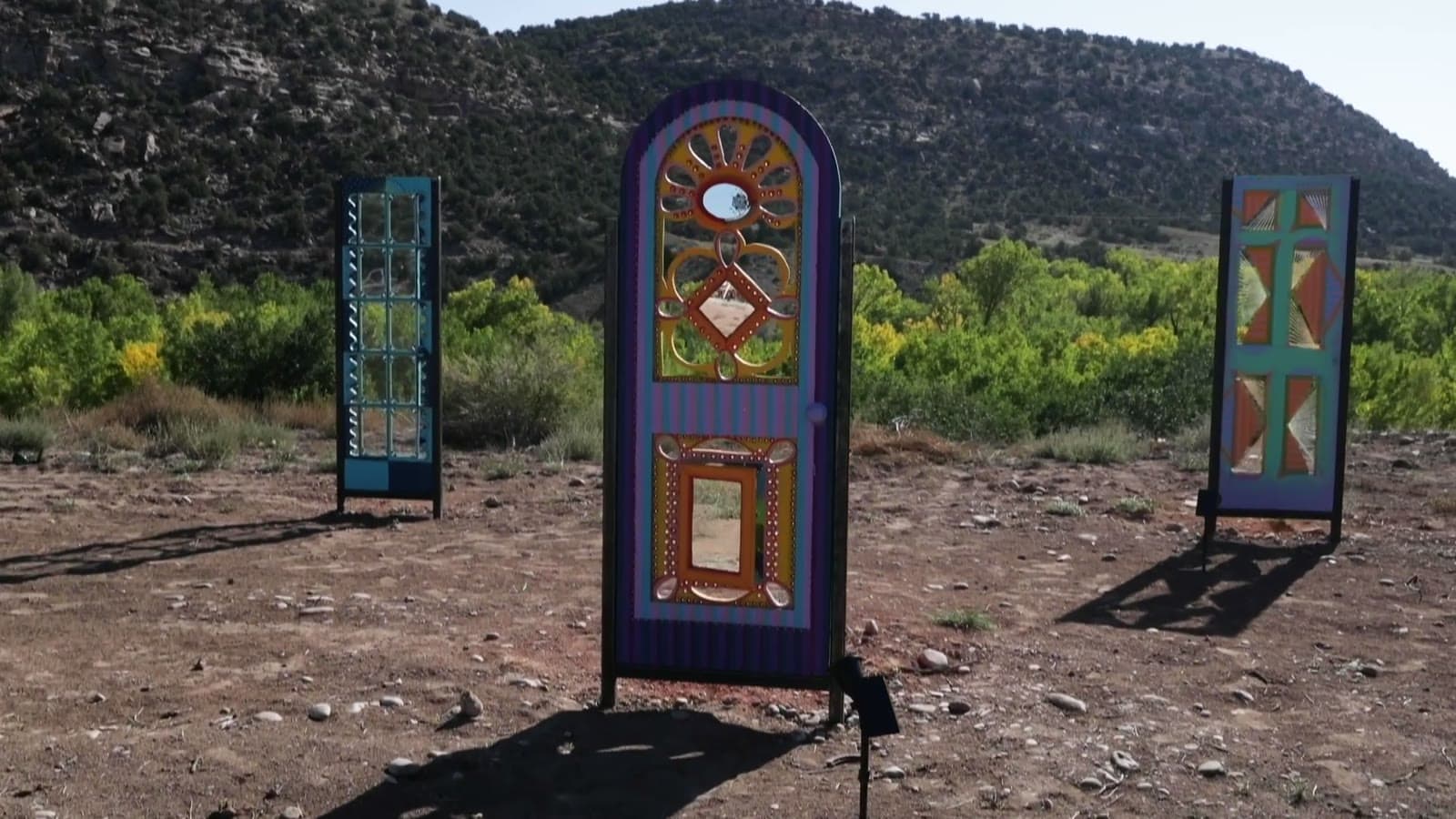 The Unknown Zone art installation of painted freestanding doors at Camp V