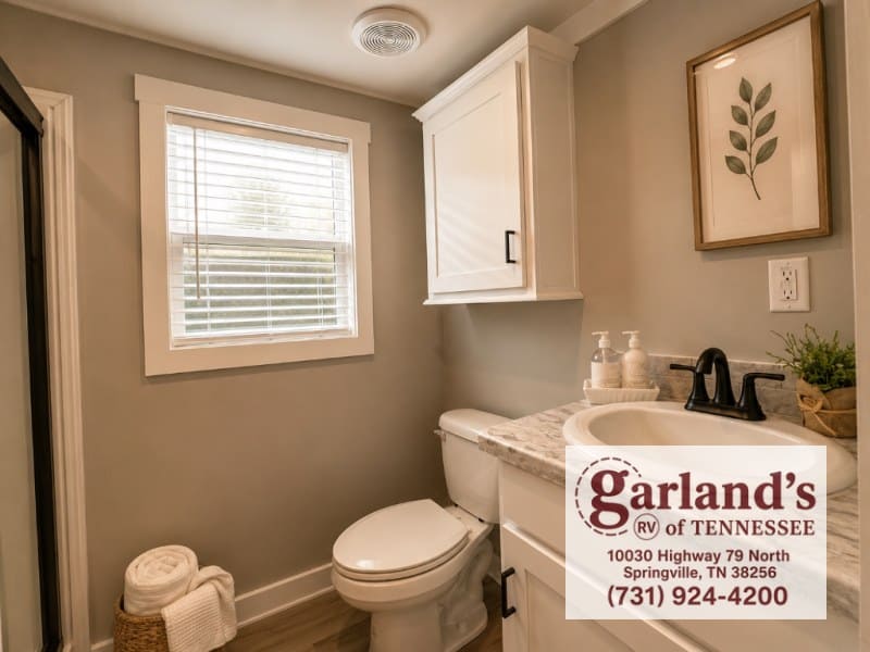 Clayton Coldwater bathroom with vanity, toilet, and window