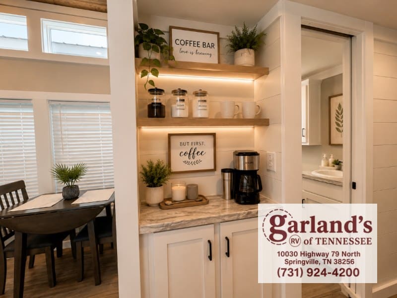 Coffee bar with open wood shelves and a small dining table in the Clayton Coldwater