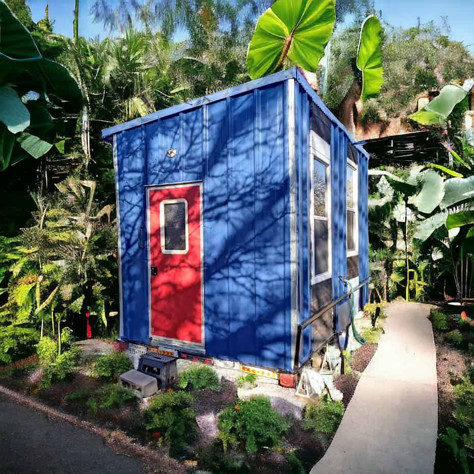 Custom 14×8 tiny house Texas blue corrugated metal red door